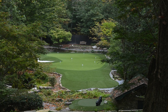Metro New York Synthetic Putting Green amidst trees