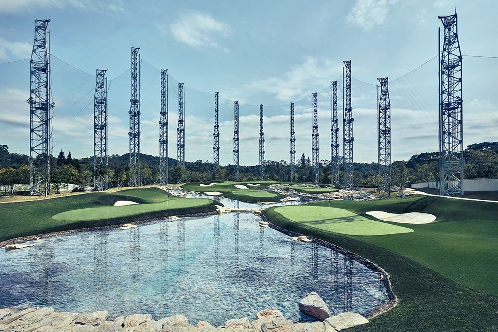 Metro New York Synthetic grass golf course with water and tall metal towers